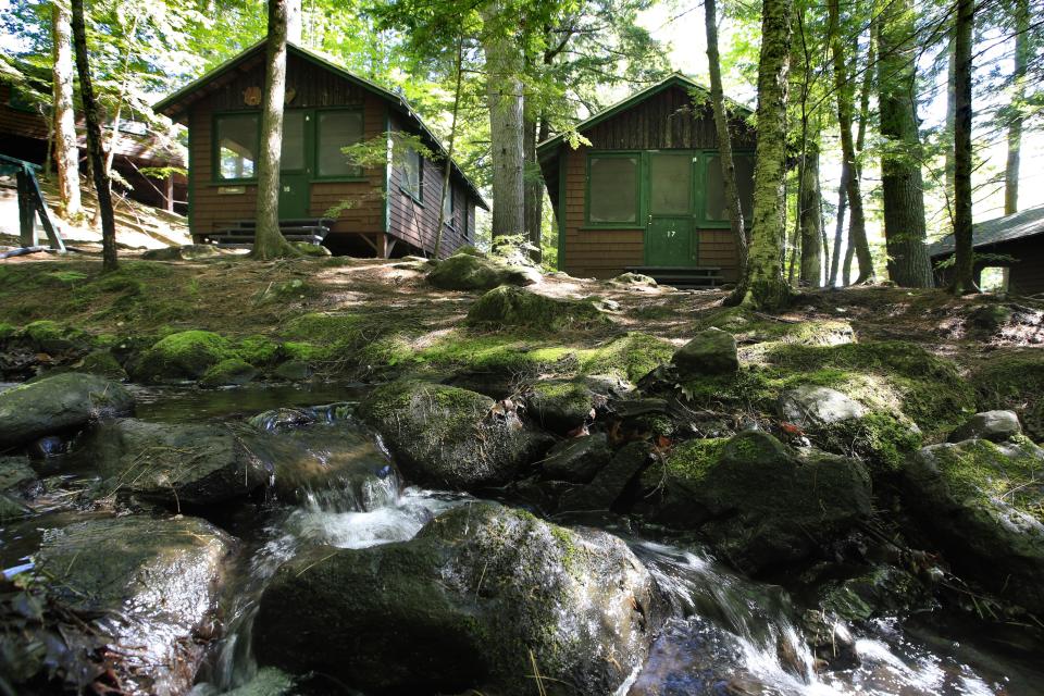 In this Thursday, June 4, 2020 photo, cabins awaits campers at the Camp Winnebago summer camp in Fayette, Maine. (Robert F. Bukaty/AP Photo)