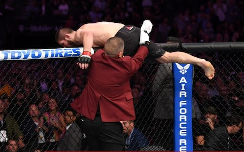 Khabib Nurmagomedov of Russia leaves the octagon at the end of his UFC lightweight bout - Credit: Josh Hedges/Zuffa