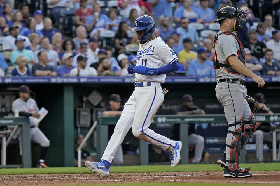 Kansas City Royals' Maikel Garcia (11) crosses the plate past Detroit Tigers catcher Jake Rogers to score on a sacrifice fly hit by Salvador Perez during the fourth inning of a baseball game Tuesday, May 23, 2023, in Kansas City, Mo. (AP Photo/Charlie Riedel)