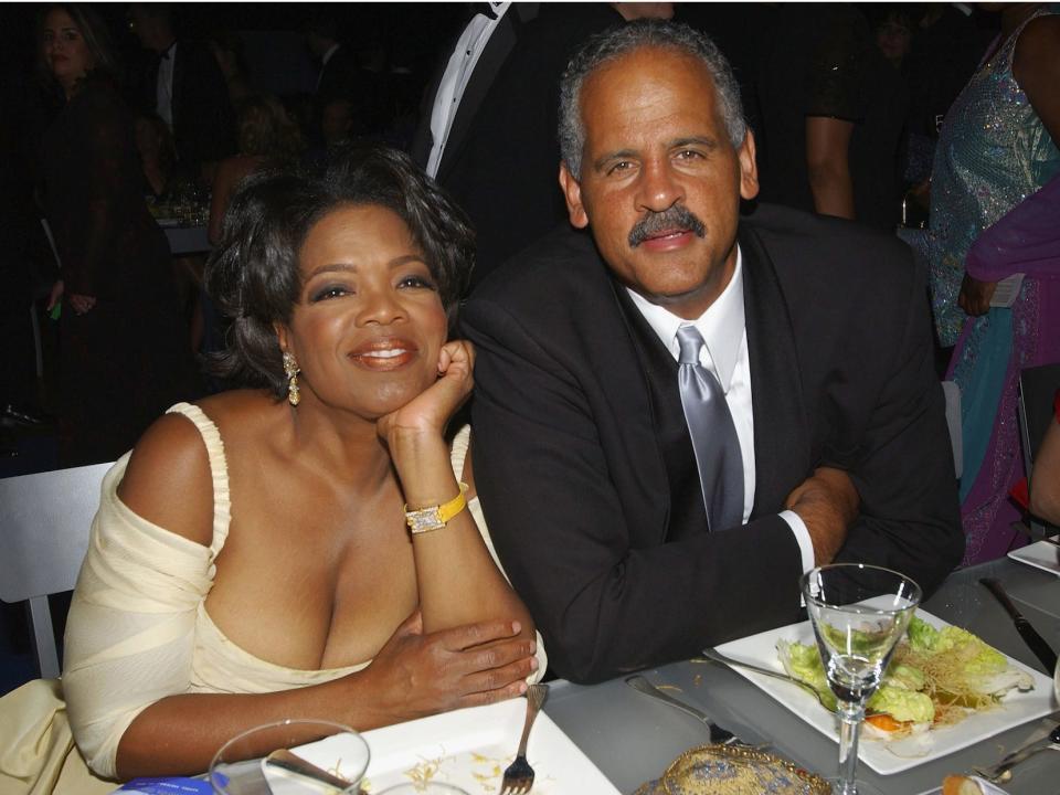 Oprah Winfrey and Stedman Graham sit at a table together