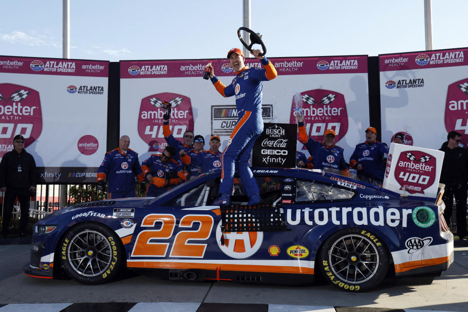 Joey Logano celebrates in Victory Lane after winning the NASCAR Cup Series auto race at Atlanta Motor Speedway, Sunday, March 19, 2023, in Hampton, Ga. (AP Photo/Butch Dill)