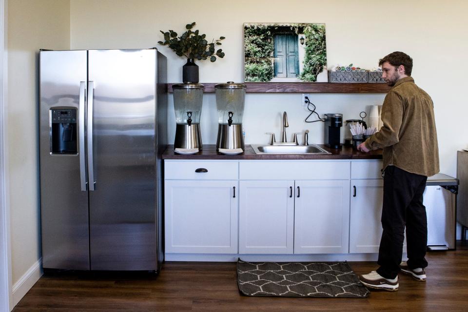 Jacob Bates gets a cup of coffee in the kitchen area at the opening of Sean's Room at Saint Mark's High School in Pike Creek on Friday, Feb. 24, 2023. In partnership with SL24: Unlocke the Light Foundation and Sean's House, Sean's Room is an offshoot of Sean's House designed to address mental health concerns and provide resources for Spartan students.