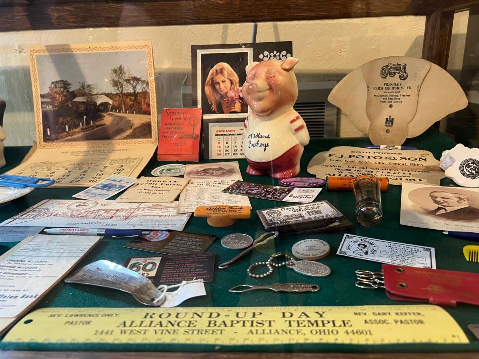 A collection of advertising novelties from various Alliance businesses, most of them no longer in existence, is on display at the Alliance History Mini Museum at the Mabel Hartzell Historical Home.