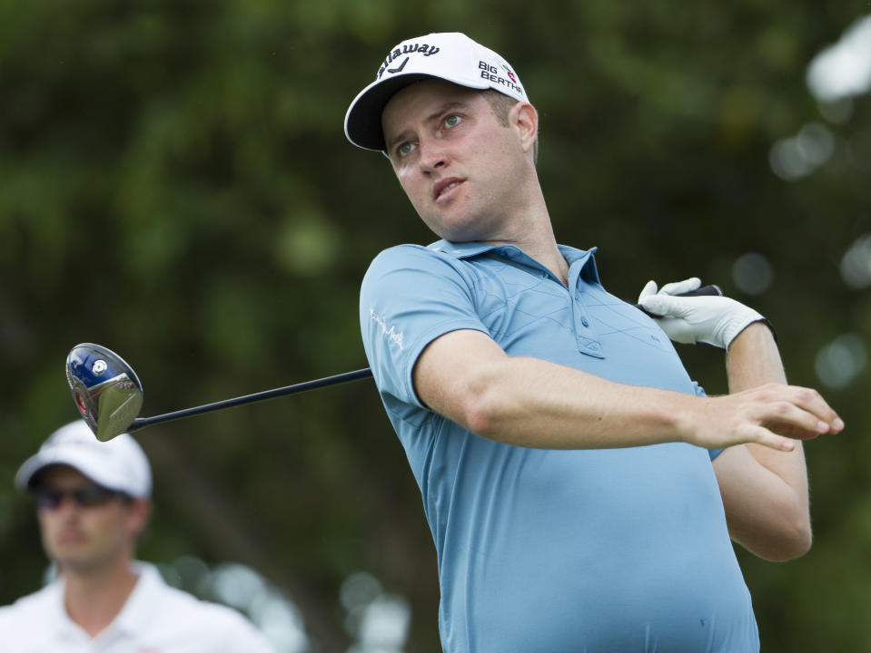 Chris Kirk watches his drive off the 12th tee during the third round of the Sony Open golf tournament at Waialae Country Club, Saturday, Jan. 11, 2014, in Honolulu. (AP Photo/Eugene Tanner)