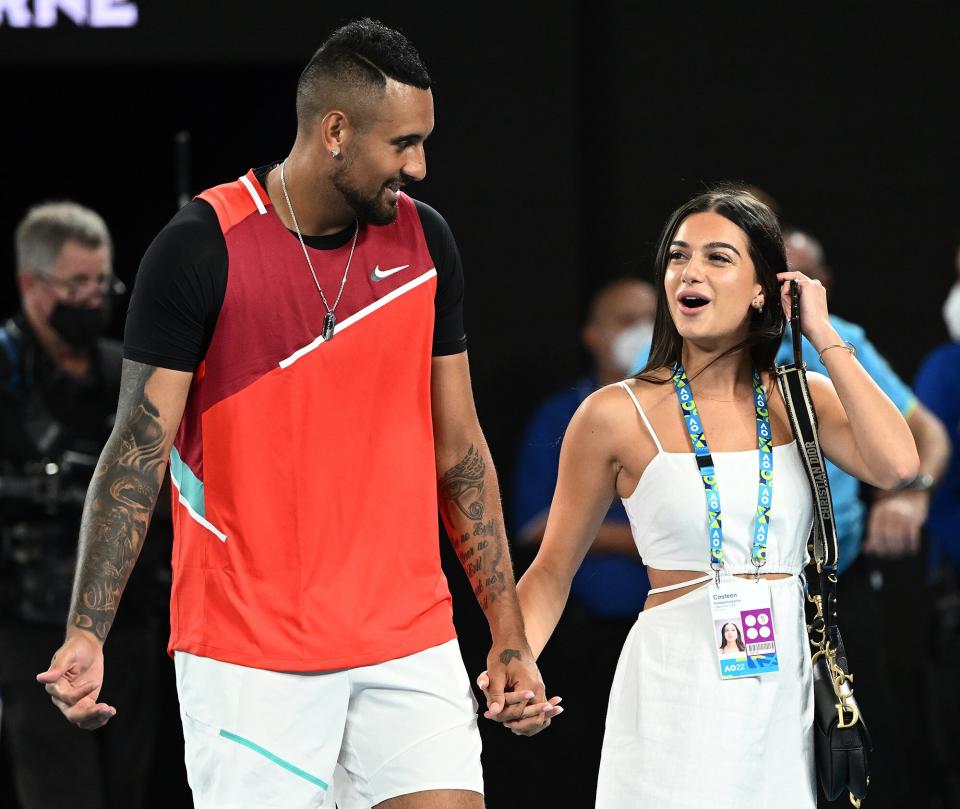 Nick Kyrgios of Australia walks with his girlfriend Costeen Hatzi after winning his Men's Doubles&nbsp;Final match on January 29, 2022 in Melbourne, Australia
