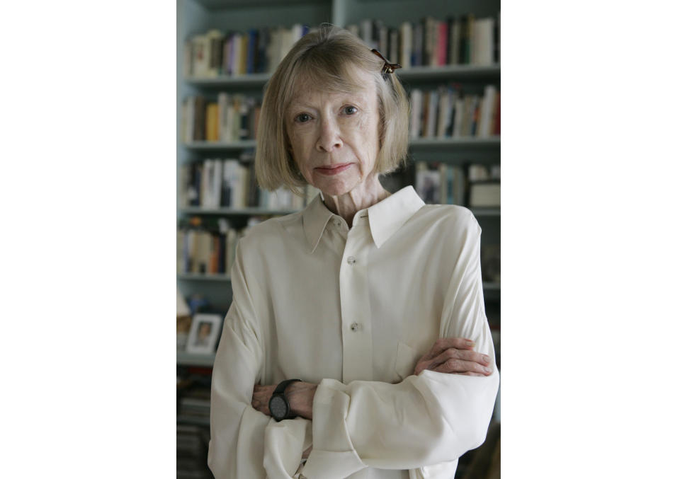 FILE - Author Joan Didion poses for a portrait, Monday, Sept. 26, 2005, in her New York apartment. The archives of the late Joan Didion and John Gregory Dunne have been acquired by the New York Public Library. (AP Photo/Kathy Willens, File)