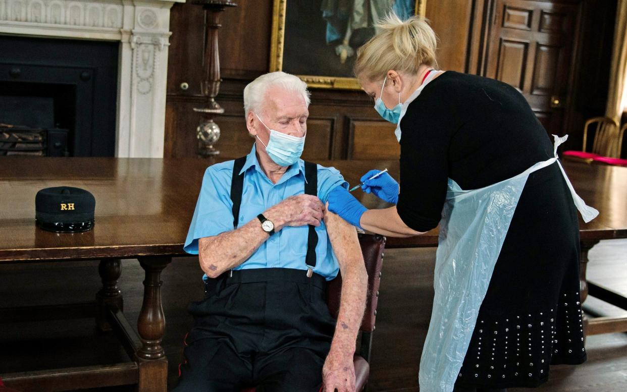 D-Day veteran Robert Sullivan, 98, is injected with the Pfizer/BioNTech Covid-19 vaccine by Chief Nurse Pippa Nightingale - Getty Images Europe 