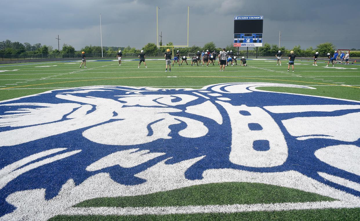 The Dundee Vikings logo is the centerpiece of the new turf field as the varsity and junior varsity practice recently inside the new John D. Craig and Family Athletic Complex.