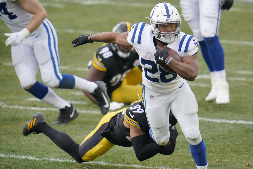 Indianapolis Colts running back Jonathan Taylor (28) tries to break a tackle by Pittsburgh Steelers free safety Minkah Fitzpatrick (39) during the second half of an NFL football game, Sunday, Dec. 27, 2020, in Pittsburgh. (AP Photo/Gene J. Puskar)