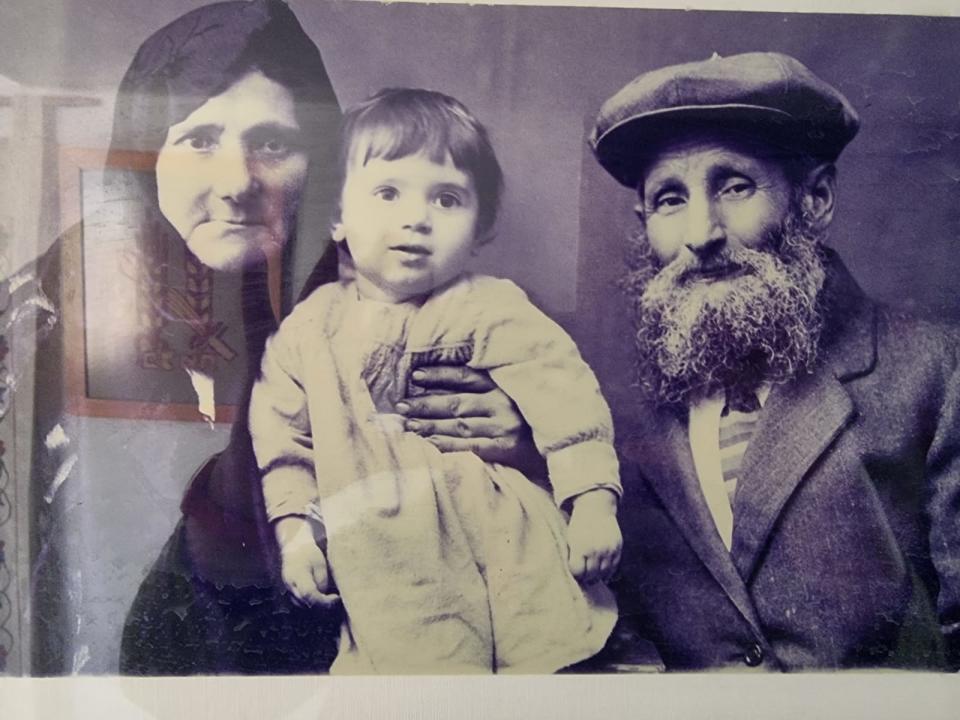 Ody Norkin's grandparents, Sara and Moshe Norkin, are shown in this photograph, holding their son (and Ody's father), Aaron. Moshe and Sara were killed during the Holocaust in Odessa, Ukraine.