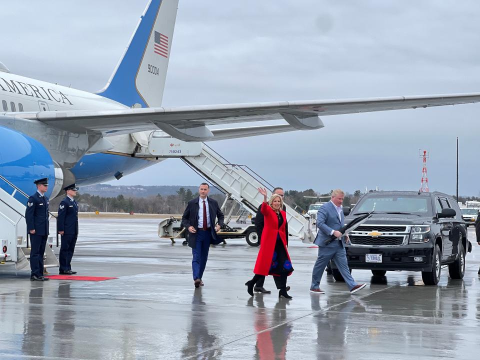 First Lady Jill Biden waves to the media after getting off of Executive One Foxtrot and landing at Patrick Leahy Burlington International Airport on April 5, 2023.