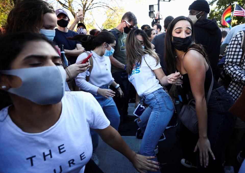 People dance on Black Lives Matter Plaza in Washington amid celebrations following the election of Joe BidenREUTERS