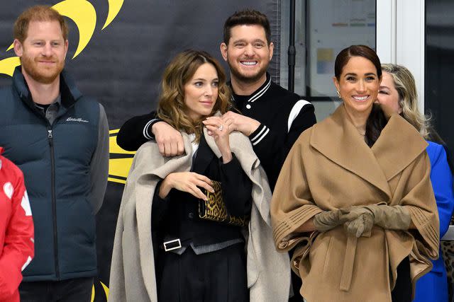 <p>Karwai Tang/WireImage</p> Prince Harry, Duke of Sussex, Luisana Lopilato, Michael Bublé and Meghan, Duchess of Sussex attend the Invictus Games One Year To Go Winter Training Camp at Hillcrest Community Centre on February 16, 2024 in Vancouver, Canada.