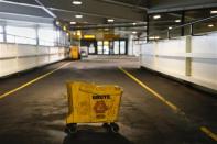 A bucket is seen under a leaky ceiling at the parking garage of the central terminal of LaGuardia Airport in the Queens borough of New York April 8, 2014. REUTERS/Shannon Stapleton