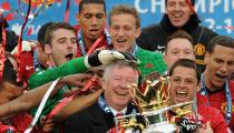 Manchester United manager Sir Alex Ferguson celebrates with the Barclays Premier League trophy after the Barclays Premier League match at Old Trafford, Manchester.