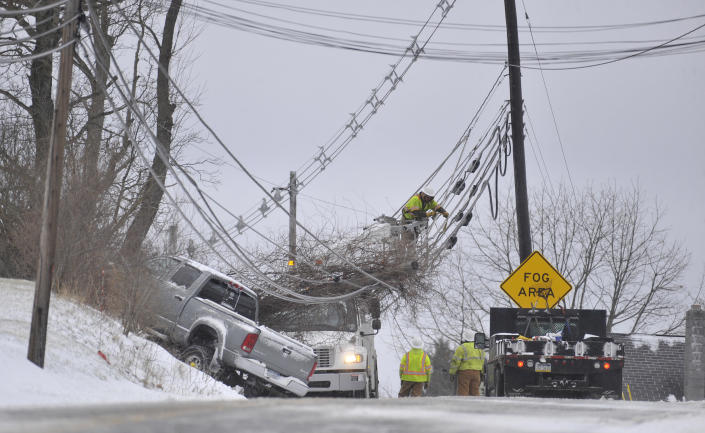 <p>A linesmen works on repairing down wires from a pickup-truck that lost control in Johnstown, Pa., on Friday, March 2, 2018. (Photo: Todd Berkey/The Tribune-Democrat via AP) </p>