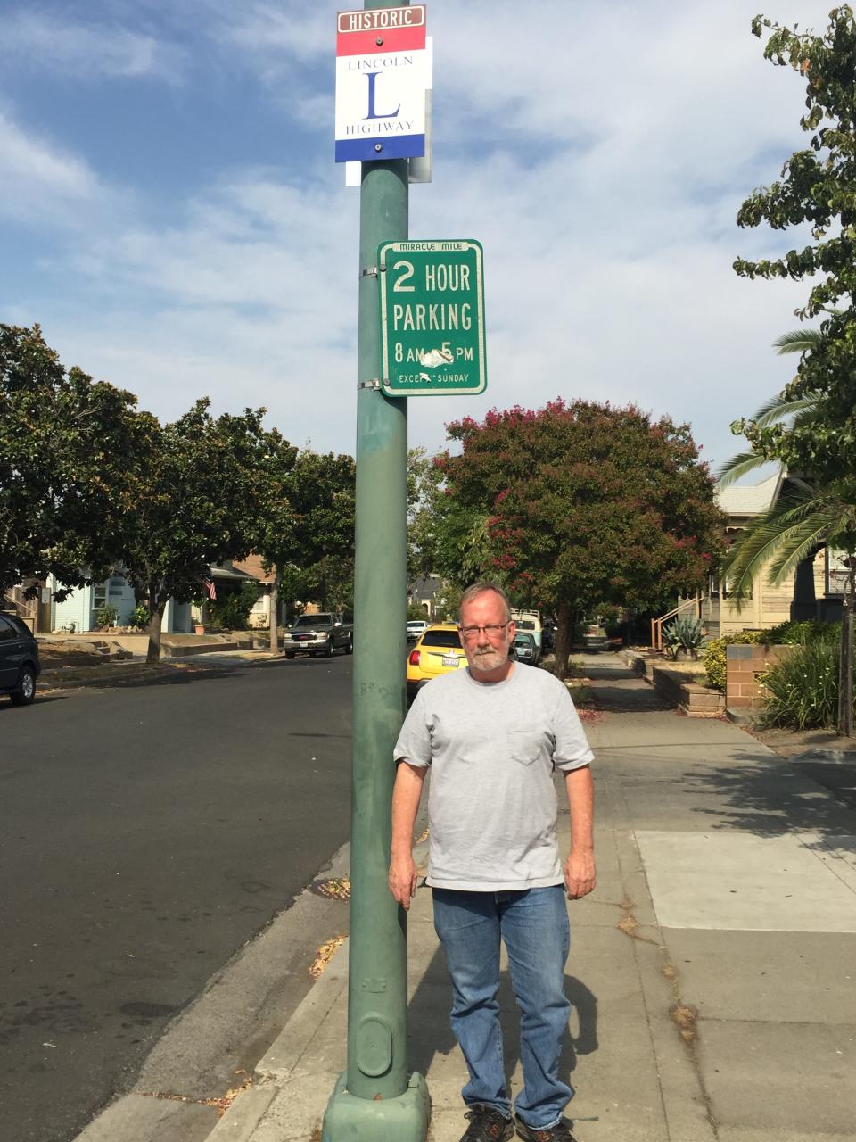 Kevin Shawver and Lincoln Highway sign on Maple Street in Stockton.