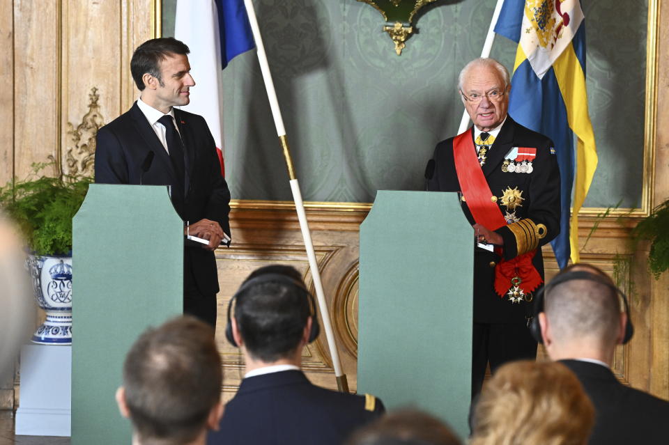 French President Emmanuel Macron, left, and King Carl Gustaf deliver a press statement at the Royal Palace in Stockholm, Sweden, Tuesday Jan. 30, 2024. France’s President Emmanuel Macron started a two-day state visit in Stockholm during which he will meet Swedish prime minister, Ulf Kristersson, and the country’s monarch, King Carl XVI Gustaf. (Claudio Bresciani/TT via AP)