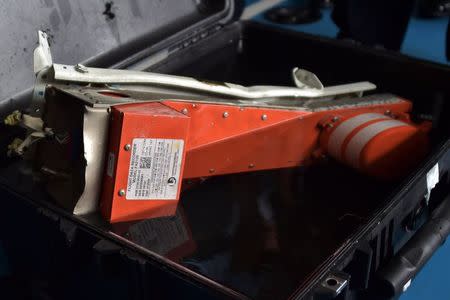 The flight data recorder of AirAsia QZ8501 is seen in a carrying case onboard Indonesian navy vessel KRI Banda Aceh, in the Java Sea January 12, 2015. REUTERS/Adek Berry/Pool