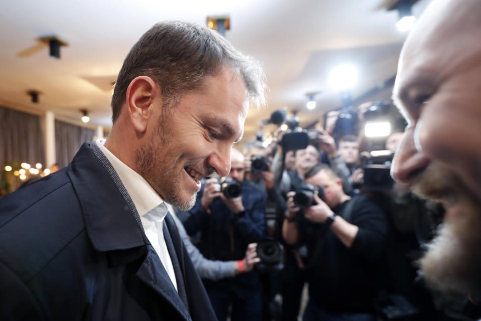 Leader of the Ordinary People and Independent Personalities party, Igor Matovic, smiles after the announcement of the general elections exit polls at the party headquarters in Trnava, Slovakia, Saturday, Feb. 29, 2020. Slovaks voted Saturday in parliamentary elections widely expected to unseat the country's long-dominant but scandal-tainted center-left party that governed on an anti-immigration platform, in favor of a coalition headed by center-right populists. (AP Photo/Petr David Josek)