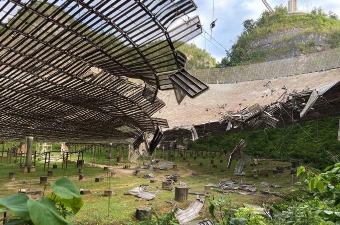 On Aug. 10, an auxiliary cable pulled free from a support tower and crashed onto the dish below, tearing a 100-foot-long gash. / Credit: University of Central Florida