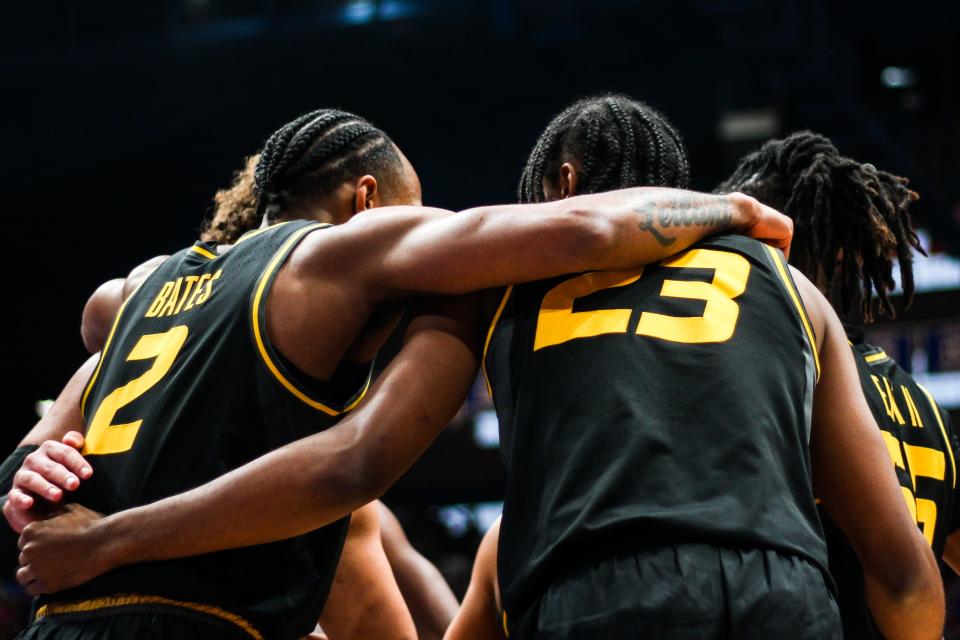 The Missouri Tigers huddle during a college basketball game against Kansas at the Allen Fieldhouse on Dec. 9, 2023, in Lawrence, Kan.