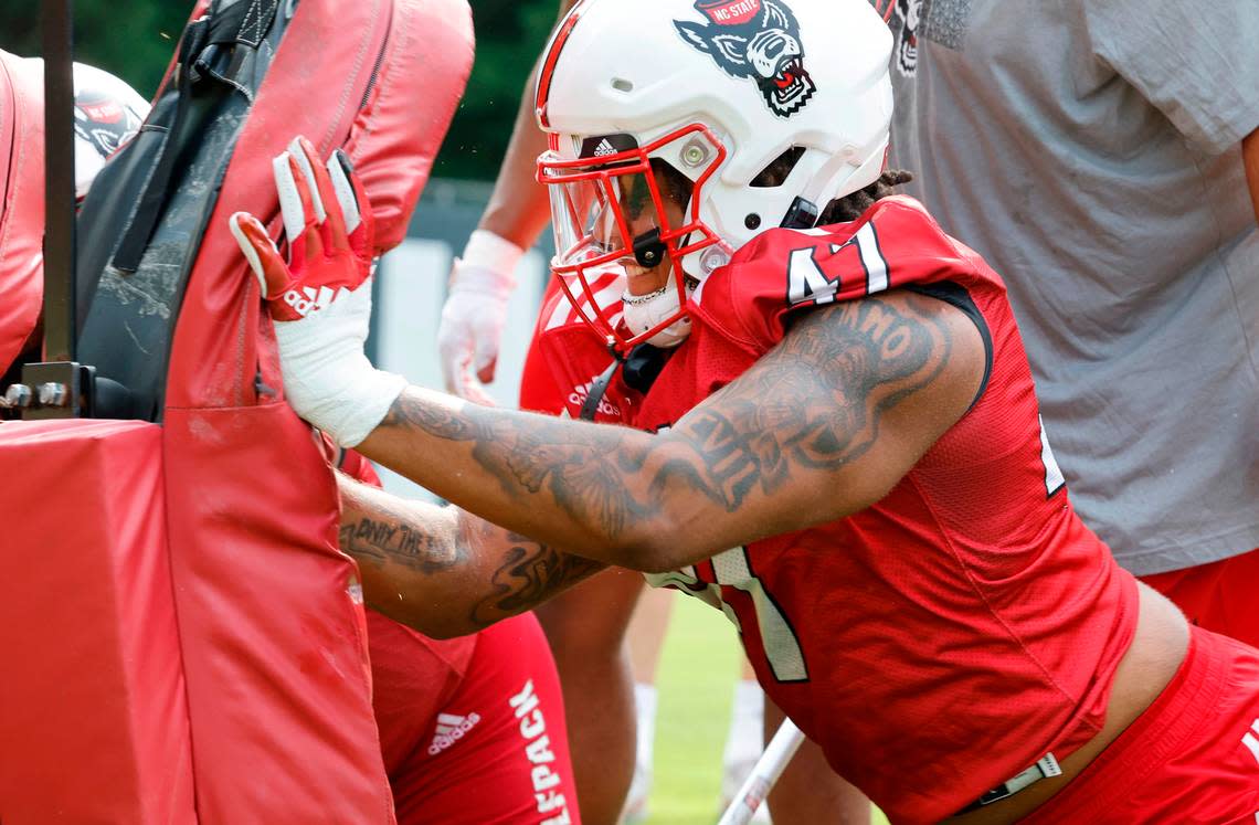 N.C. State defensive lineman Red Hibbler (47) hits the pad during the Wolfpack’s first fall practice in Raleigh, N.C., Wednesday, August 2, 2023. Ethan Hyman/ehyman@newsobserver.com