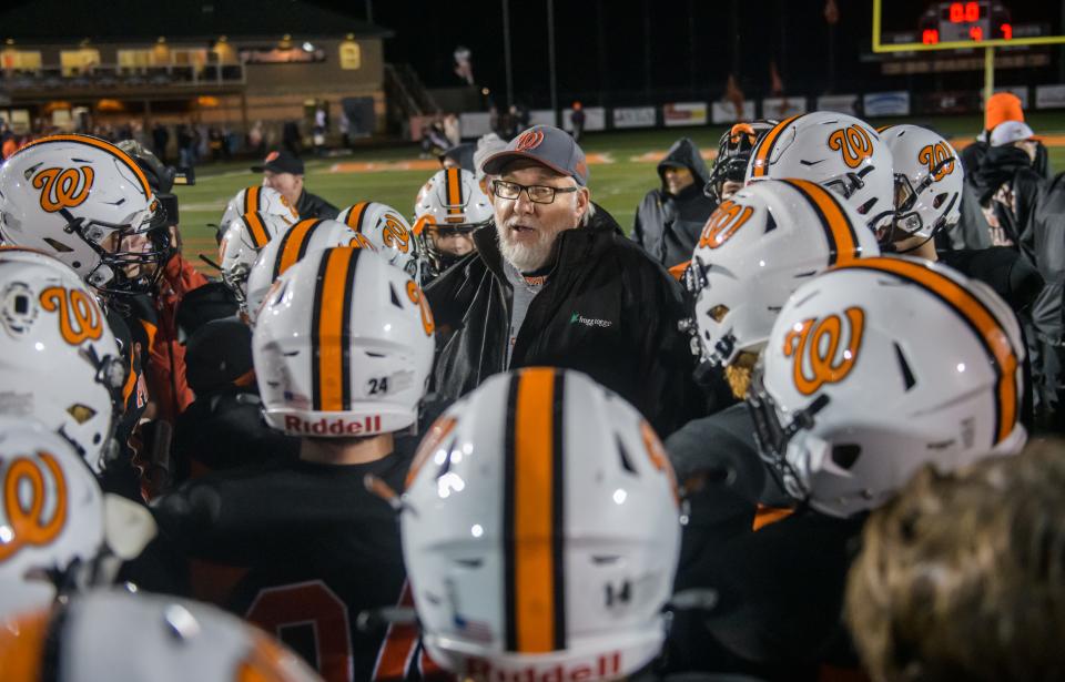 Washington head coach Darrell Crouch talks with his team after their 14-7 victory over Normal West in a Class 6A playoff game Friday, Oct. 29, 2021 in Washington.