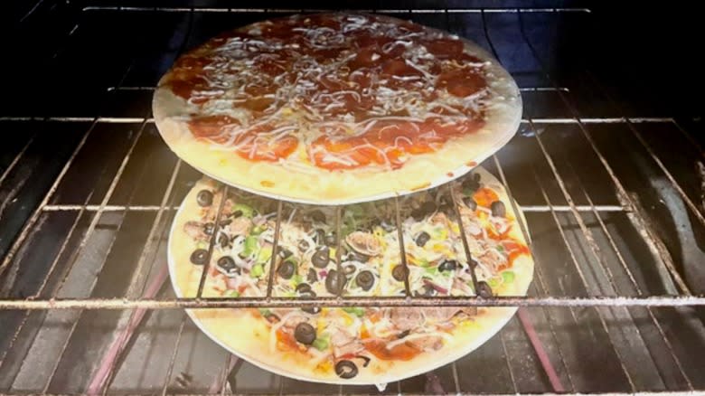 two pizzas in oven