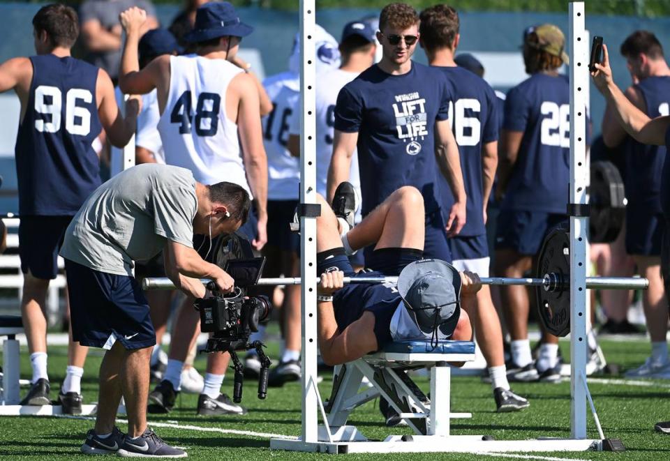 Penn State football players participate in the bench press competition during the Nittany Lions annual Lift For Life event at University Park Thursday, June 30, 2022.