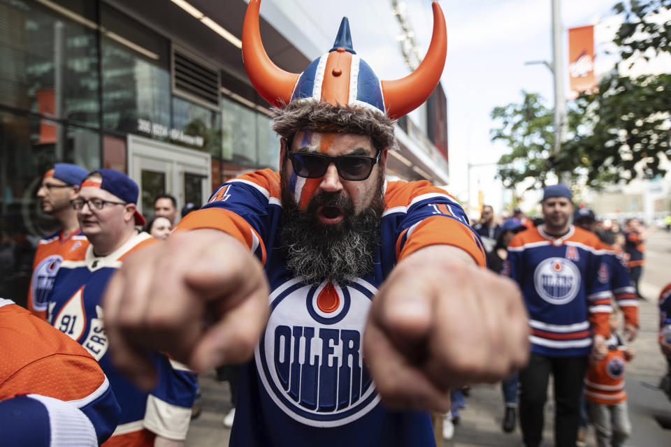 Fans make their way to watch the Florida Panthers take on the Edmonton Oilers in Game 4 of the NHL hockey Stanley Cup Final, Saturday, June 15, 2024, in Edmonton, Alberta. (Jason Franson/The Canadian Press via AP)