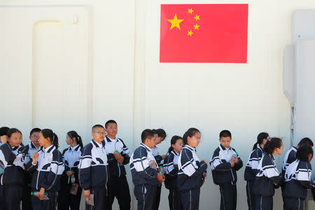 Students line up at the C-Space Project Mars simulation base in the Gobi Desert outside Jinchang, Gansu Province, China, April 17, 2019. REUTERS/Thomas Peter