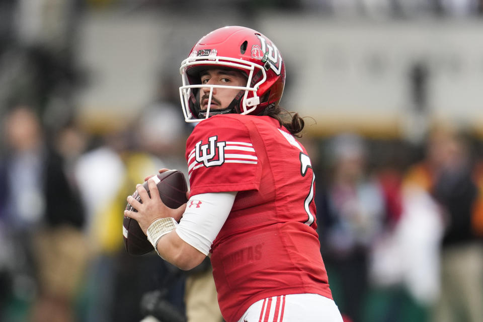 FILE - Utah quarterback Cameron Rising (7) warms up before the team's Rose Bowl NCAA college football game against Penn State Monday, Jan. 2, 2023, in Pasadena, Calif. Utah opens their season at home against Florida on Aug. 31. (AP Photo/Marcio Jose Sanchez, File)