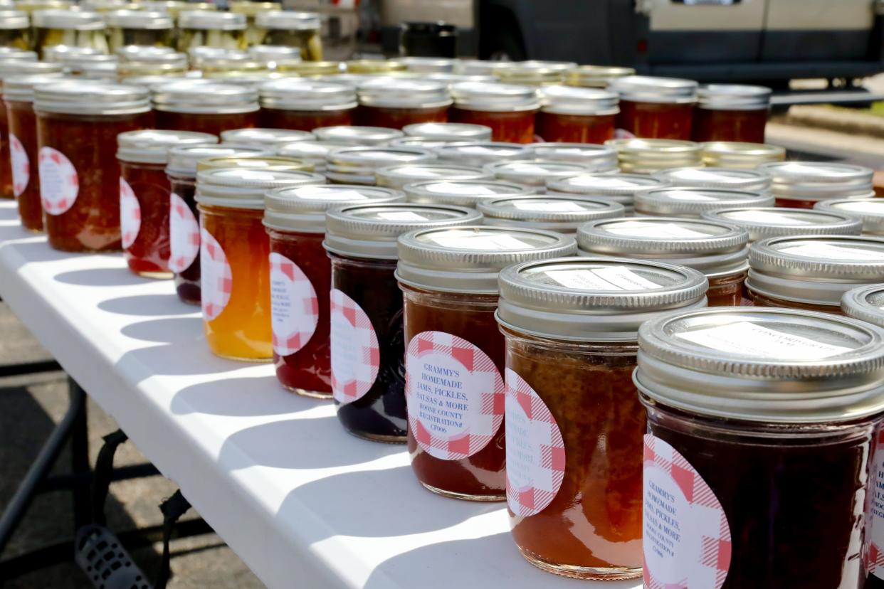 Jars of jam and jelly are displayed for sale Friday, May 5, 2023, during the Forest City Farmers Market-Colonial Village in Rockford.