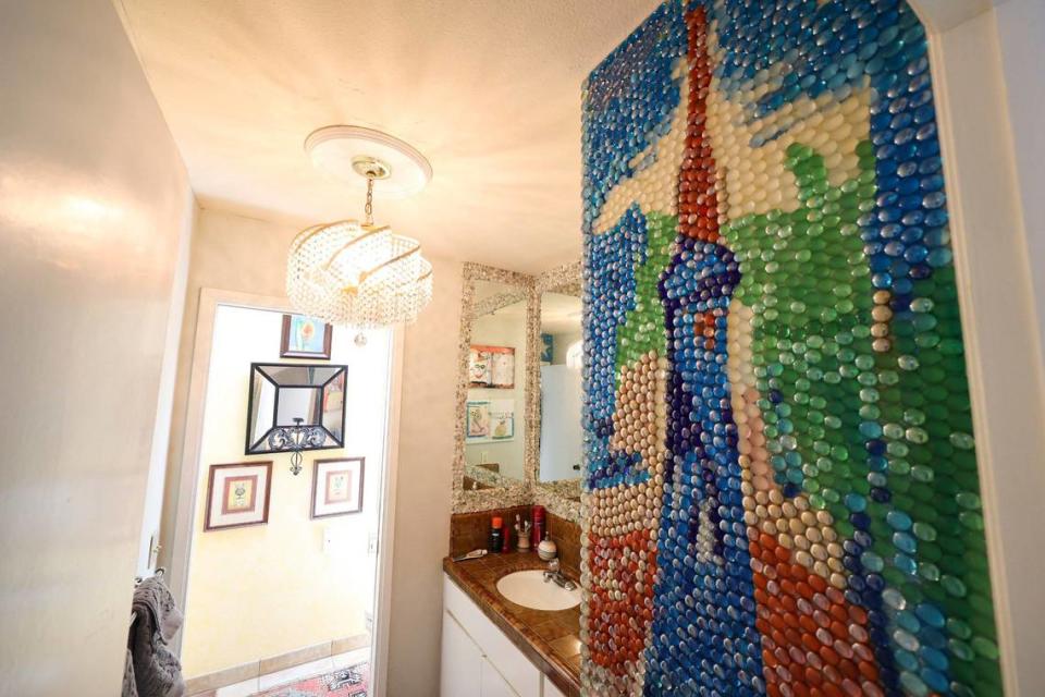 A colorful mosaic accents a bathroom in the San Luis Obispo home owned by Bruce and Suki Mason, seen here on May 10, 2024. Suki created all the mural-sized artwork.