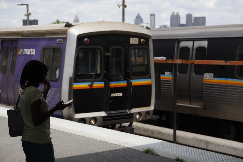 In this Tuesday, Aug. 20, 2019, photo, a woman waits to board a Metropolitan Atlanta Rapid Transit Authority train at West End Station in Atlanta. (Photo: Andrea Smith via AP)