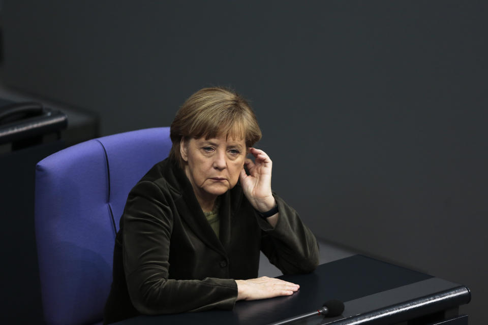 German Chancellor Angela Merkel listens to the debate about the situation in the Ukraine and possible reactions of the European Union a the parliament Bundestag in Berlin, Thursday, Feb. 20, 2014. German Foreign Minister Frank-Walter Steinmeier and his counterparts from Poland Radoslaw Sikorski and France Laurent Fabius travel to Ukraine today for talks with official authorities and opposition leaders. (AP Photo/Markus Schreiber)