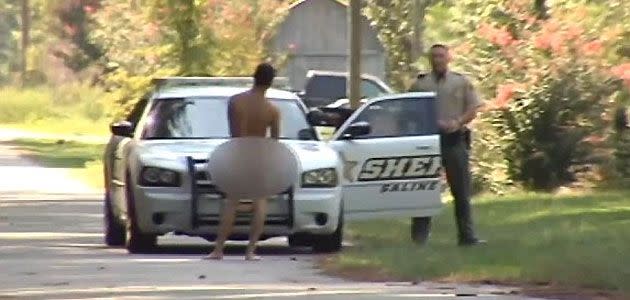 Police appraoch the nude man, Photo: KARK TV