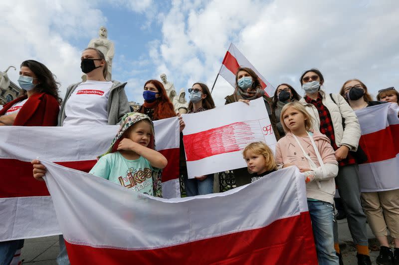 Demonstrators attend a rally in solidarity with Belarusian opposition in Kyiv