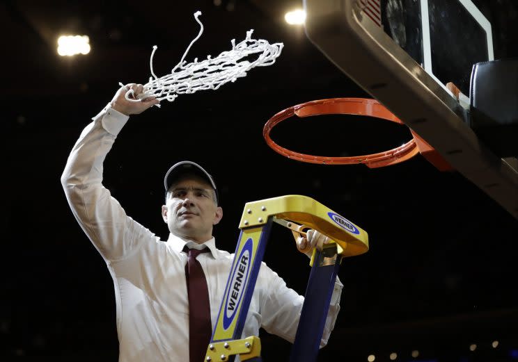 South Carolina head coach Frank Martin swings the net around after cutting it down after beating Florida 77-70 in the East Regional championship game of the NCAA men’s college basketball tournament, Sunday, March 26, 2017, in New York. (AP Photo/Julio Cortez)