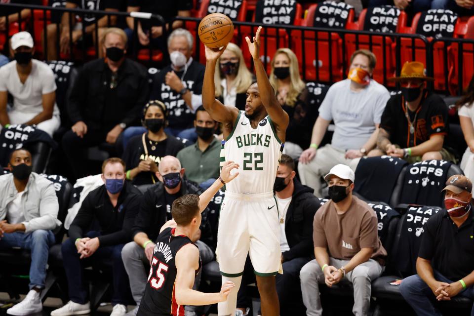 Khris Middleton shoots over Duncan Robinson of the Miami Heat in the Eastern Conference first round in 2021.