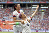 FILE - In this July 7, 2019, file photo, United States' Megan Rapinoe, right, celebrates after scoring the opening goal from the penalty spot during the Women's World Cup final soccer match between U.S. and The Netherlands at the Stade de Lyon in Decines, outside Lyon, France. The members of the U.S. women's soccer team, with Rapinoe spearheading the move, brought their longstanding fight for equal pay to the fore during their march to the World Cup title this summer. (AP Photo/Francisco Seco, File)