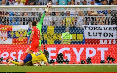 Jordan Pickford does well to get behind Marcus Berg's shot - diving high with his left hand - Credit: Ulrik Pedersen/Action Plus