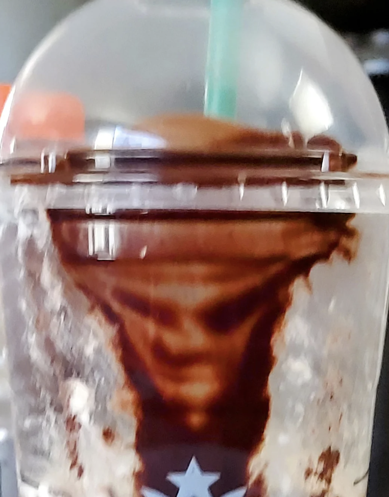 A face in someone's coffee