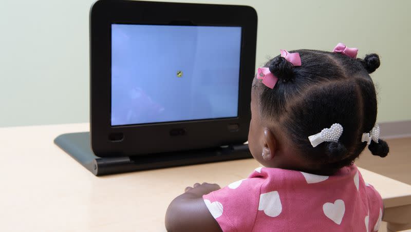 A child uses the EarliPoint Evaluation, a tool designed for earlier detection and assessment of autism in children.