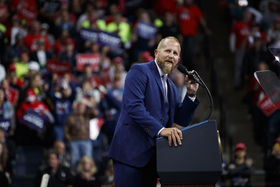 FILE - In this Oct. 10, 2019, file photo, Brad Parscale, campaign manager for President Donald Trump speaks during a campaign rally at the Target Center in Minneapolis. A half-dozen senior advisers to President Donald Trump have repeatedly voted by mail, according to election records obtained by The Associated Press, undercutting the president’s argument that the practice will lead to widespread fraud this November. The aides include Betsy DeVos, the education secretary who has permanent absentee voting status in her home state of Michigan. Parscale voted absentee in Texas in 2018 and didn't vote in the general election two years earlier when Trump's name was on the ballot. (AP Photo/Evan Vucci, File)