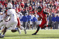 Cincinnati quarterback Desmond Ridder (9) runs for a touchdown during the first half of an NCAA college football game against Tulsa on Saturday, Nov. 6, 2021, in Cincinnati. (AP Photo/Jeff Dean)