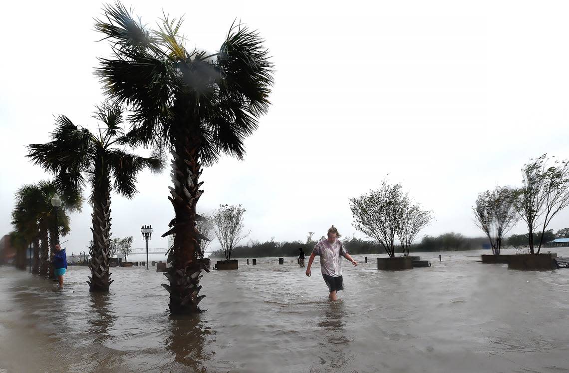 Zach Sullivan walks down a flooded Water Street as the Cape Fear River overflows it’s banks as Hurricane Florence made landfall Friday Sept. 14, 2018. Subsidence will increase the risk of flooding in the city, according to a new study.