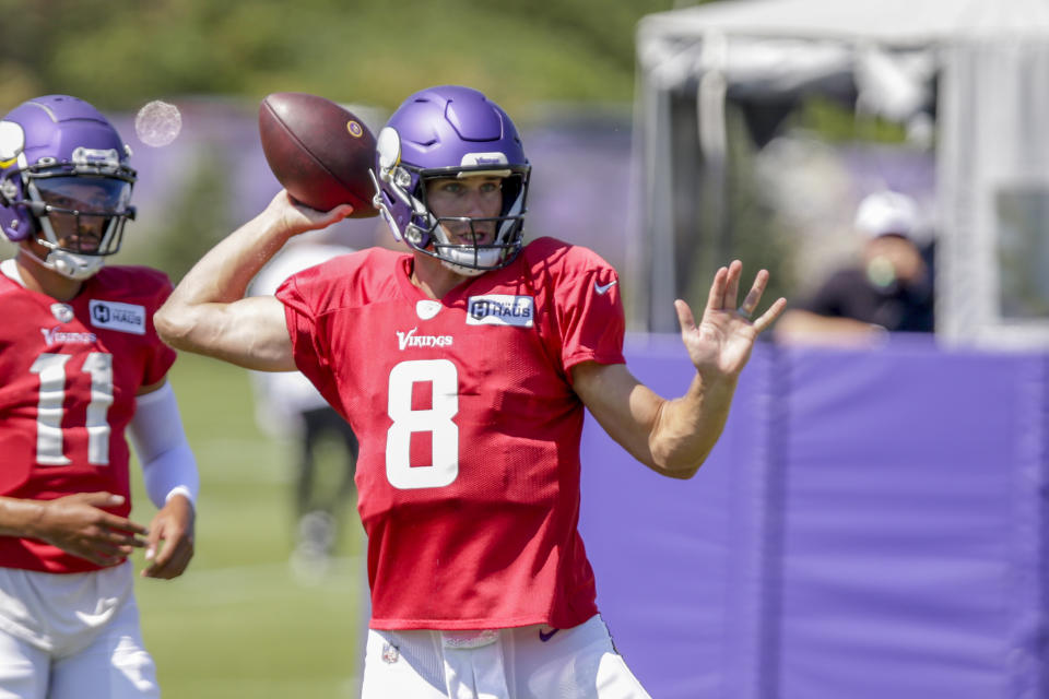 Minnesota Vikings quarterback Kirk Cousins prepares to throw at the NFL football team's practice facility in Eagan, Minn., Monday, Aug. 1, 2022. (AP Photo/Andy Clayton-King)