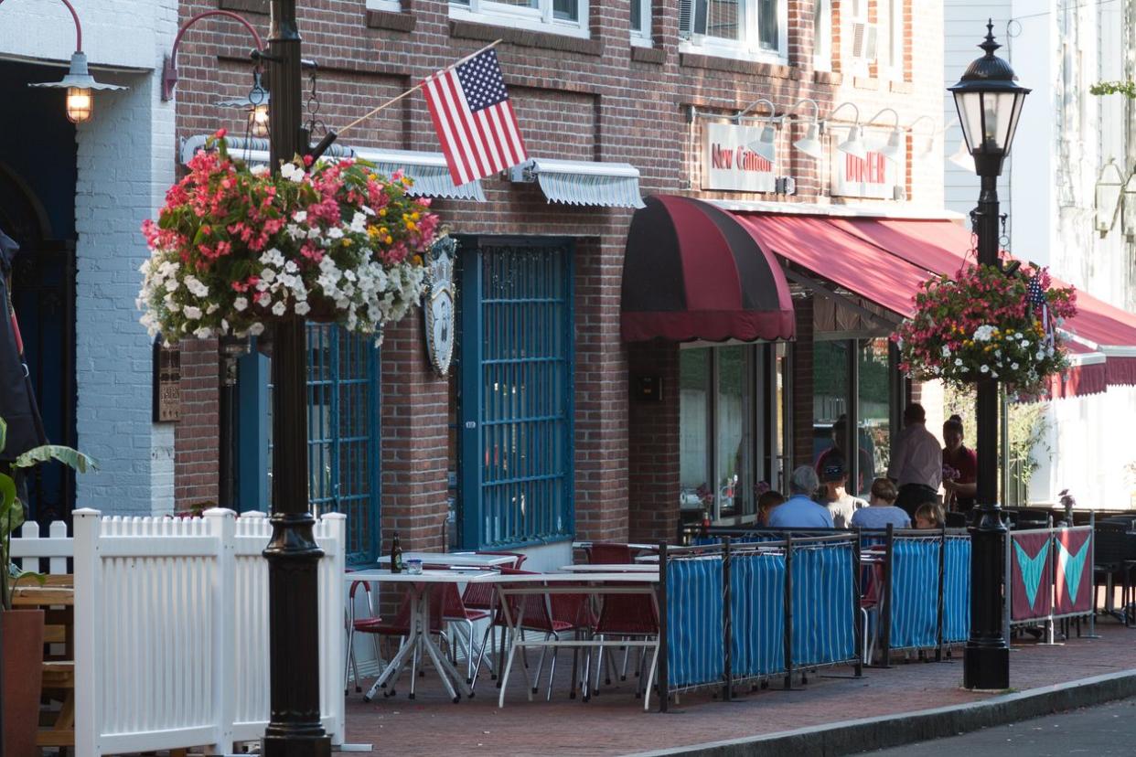 People having lunch at the local restaurant located in the downtown business area in the town of New Canaan.